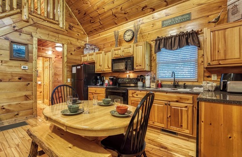 Gatlinburg - Pigeon Forge Cabin | Private Wooded Setting! Theater Room! Centrally Located! 3 Decks! Fun Game Room