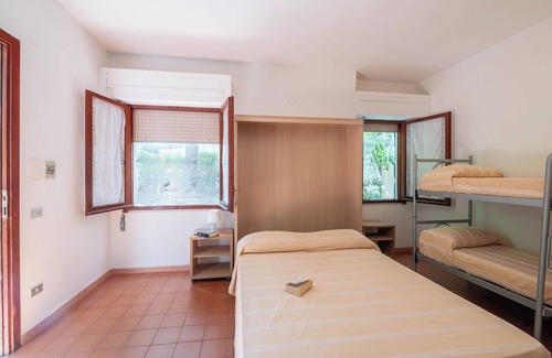 Grotta dell'acqua Resort | Property In A Holiday Village 'Monolocale Con Giardino' with Shared Pool and Air Conditioning