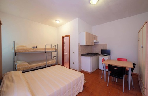 Grotta dell'acqua Resort | Property In A Holiday Village 'Monolocale Con Giardino' with Shared Pool and Air Conditioning