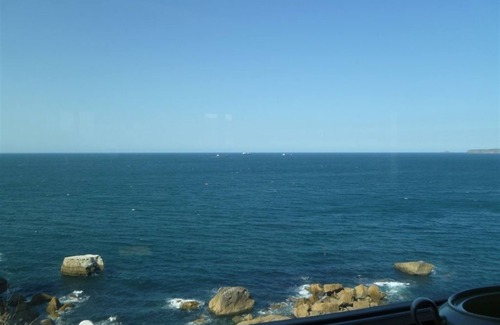 Castrillon Villa | Property on beautiful seacliff. Beach downstairs