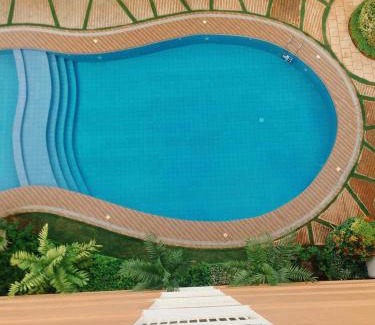 Puerto Princesa City Centre Apartment | Puerto Princesa Palawan Queen Bed Studio with Pool, Gym, Security, View