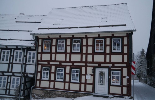 Hohegeiß Apartment | Quaint half-timbered house in the Harz Mountains. Renovated vacation apartment with fireplace & wooden terrace