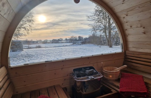 Gunneby House | Quaint, modern log cabin with barrel sauna, panoramic windows, Schlei view.