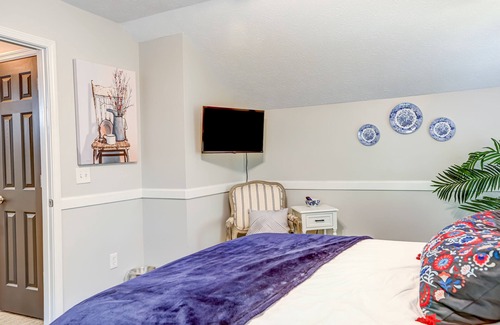 Epworth Cottage | Quaint wooded escape with wraparound deck, firepit, & fast WiFi - dog-friendly