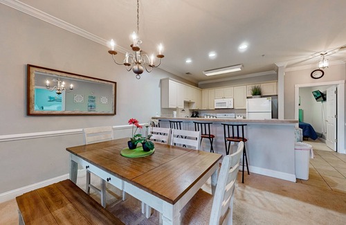 Central Myrtle Beach Condo | Quiet golf community with security, covered balcony, W/D, AC, & pool access