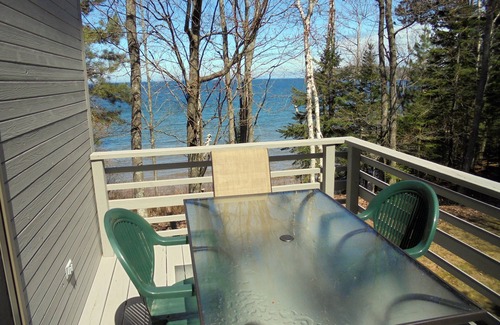 Marquette Apartment | Quiet, isolated oasis on 300 feet of Lake Superior beach and 10 wooded acres.