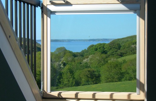 Helford Passage Cottage | Quirky luxury chalet-style cottage, beautiful sea views across a wooded valley