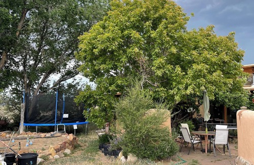 Arroyo Hondo House | Rainbows, Rivers and Sunsets: Unique off-grid solar 3-bedroom home in El Prado