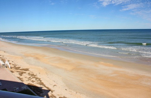 New Smyrna Beach Condo | Rare three bedroom end condo. Two bedrooms face the ocean with private balcony from Master bedroom.