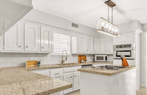 Seven Coves House | Relax and unwind on the deck with water view of Lake Conroe
