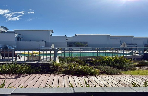 Batehaven Apartment | Relax by the Pool in This Stylish Batehaven Stay