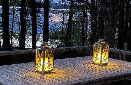 Oxford Cottage | Relax in the glow of a campfire at this waterfront cottage on Thompson Lake