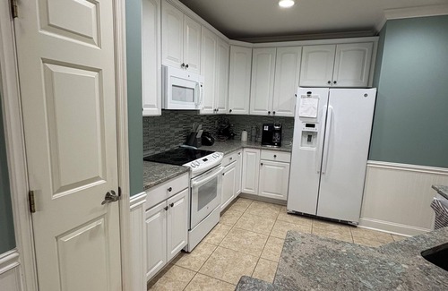 Sunset Island Condo | Relax in this 3BR 2BA second floor condo in gated community with pool and beach