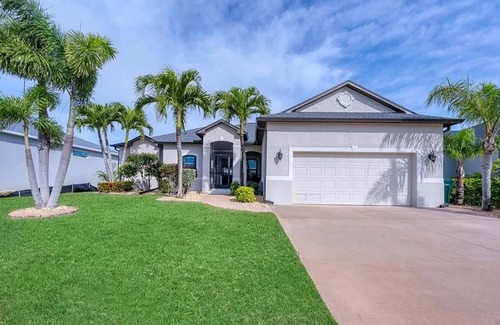 South Gulf Cove House | Relaxing 3 Bedroom - On the canal, private pool, boat dock & access to the gulf.