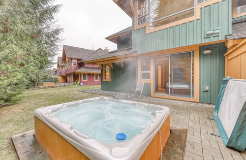 Village North House | Relaxing first-floor townhouse with a private hot tub, fireplace, & great views