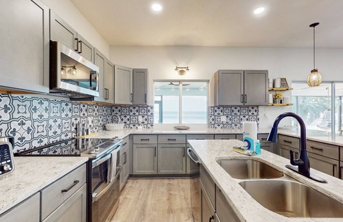 Lake Placid House | Renovated lakefront retreat with screened pool, private dock, patio, grill & W/D