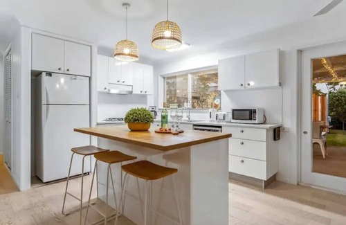 Pelican Waters House | Retreat in Golden Beach: 2 Buildings, 5 Bedrooms, Close to Attractions