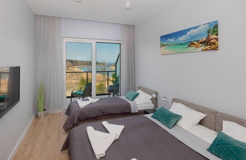 Dziwnow Apartment | Riverfront Apartment by Renters