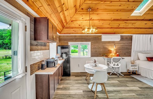 Montague Cottage | Romantic cottage, Lake MI access, wi-fi, king bed, solo stove, sunset views