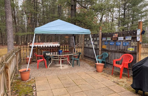 Prudenville House | Rustic home on wooded lot, very private. Lake and dock access. Close to trails.