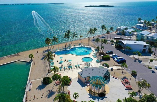 Cudjoe Key RV Rental | RV Lot 301 Venture Out, Pull-through Lot near the Ocean and Pool - Golf cart friendly!