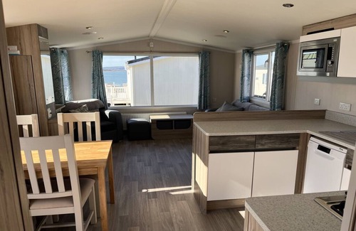 Hamworthy House | Safari Sunset caravan + sea view at Rockley Park, Poole Harbour. Dogs stay free!