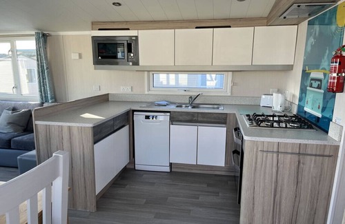 Hamworthy House | Safari Sunset caravan + sea view at Rockley Park, Poole Harbour. Dogs stay free!