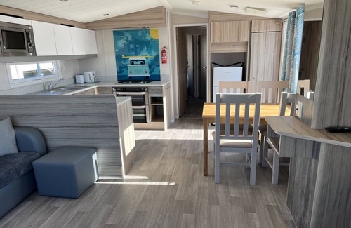 Hamworthy House | Safari Sunset caravan + sea view at Rockley Park, Poole Harbour. Dogs stay free!