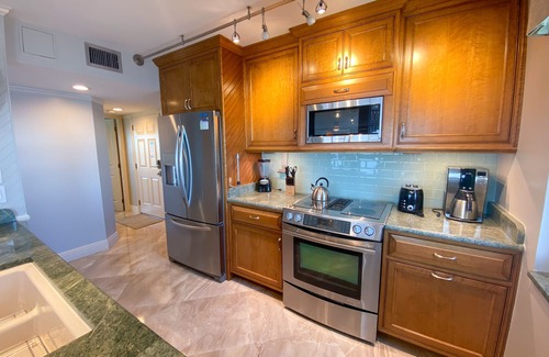 Punta Rassa Condo | Sanibel Harbour 817: Wrap-around lanai-Amazing Water Views! Enjoy private beach &activities nearby.