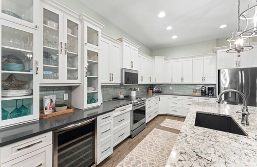 Bonita Springs House | Seafoam Serenity - Bayfront Retreat w/Dock, Pool & 1 Min Walk to Bonita Beach