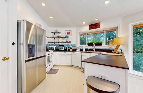Whittier House | Secluded home with firepit, deck and open windows to nature