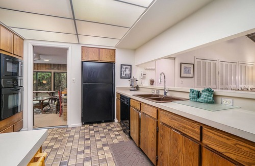Maple City Cottage | Secluded home with three kitchens, vaulted ceilings, washer/dryer, & patios