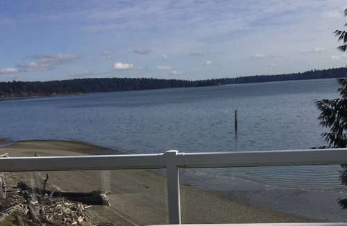 Olympia House | Serene Puget Sound waterfront home with beach access and Mt Rainer view.