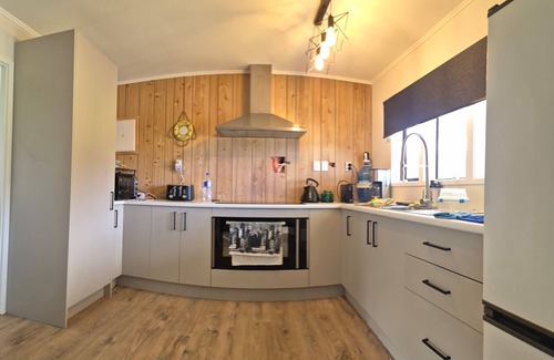 Port Charles Cottage | Set Sail for Relaxation.nCosy Beachside Cottage at Port Charles.