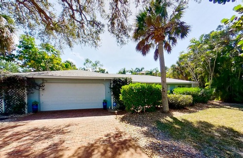 Bay Isle House | Siesta Key home with private pool, spa, fenced yard, screened lanai, & AC