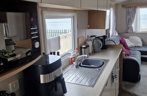 Kinmel Bay Cabin | Six Berth- Pet Friendly please ask ,Free WiFi ,Private secure decking,- Sea front with amazing views, Not to be missed