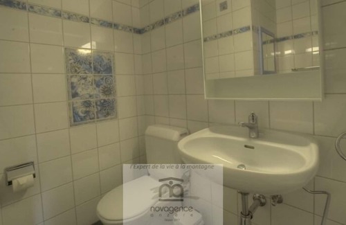 Monteiller Apartment | South facing studio with balcony, 1 double bed, 1 bathroom/WC, sofas, chimney and TV. The closed kit