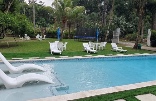 Omoa House | Spacious 2-story house with large green areas, swimming pool and close to the beach.