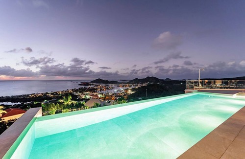 Jolly Harbour House | Spacious 6 bedroom hillside villa w/infinity pool, gym, and stunning views.