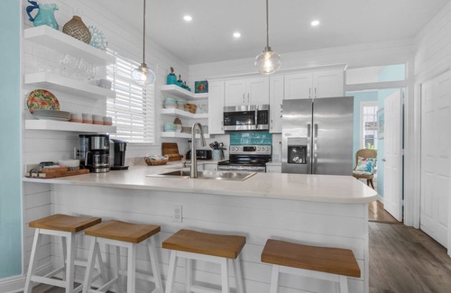Crystal Shores House | Spacious beach house steps to the powdery white side and emerald water.