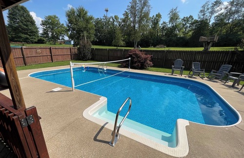 Keene House | Spacious family Lodge with solar heated pool, hot tub, fire pit and EV charger.