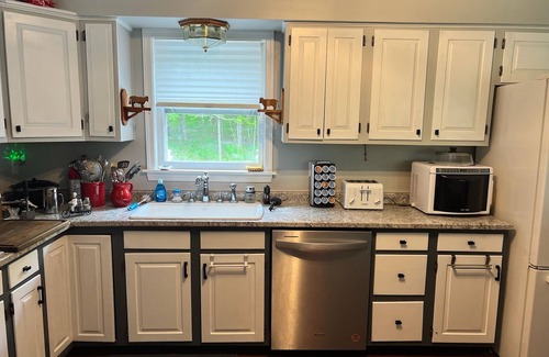 Pittsburg House | Spacious five-bedroom home off Back Lake with direct trail access on Spooner Rd