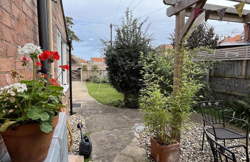 Sheringham Apartment | Spacious home, moments from beach/shops. Private parking, garden. Pet friendly.