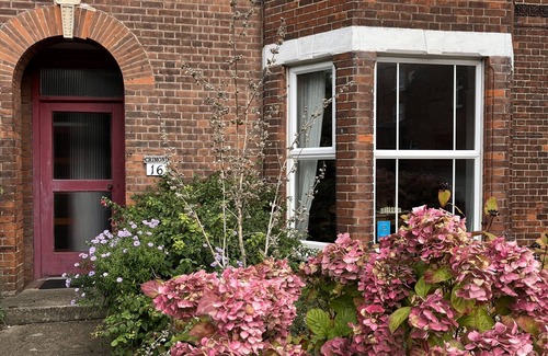 Sheringham Apartment | Spacious home, moments from beach/shops. Private parking, garden. Pet friendly.
