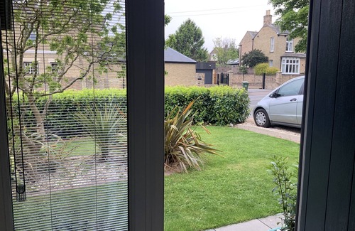 Eaton Socon House | Spacious, modern family home. Open and airy in summer, cosy log fire in winter.