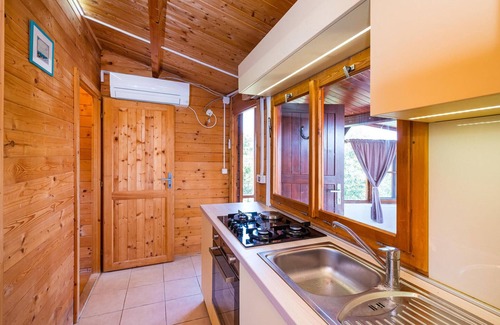 Mali Iz House | Spend your vacation in this cute little house near the beach.