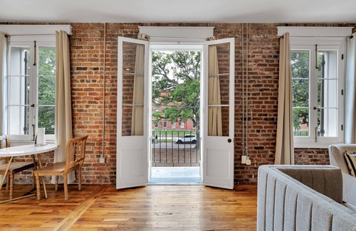 Faubourg Marigny Hotel | Stay in the center of the action with this charming 1-bedroom retreat located on the historic Esplanade Avenue. This unique space combines timeless New Orleans elegance with modern comfort, offering a serene escape just steps from Frenchmen Street.
