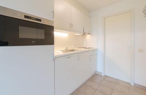 De Haan Apartment | Studio Siena with parking and shared pool by Interhome