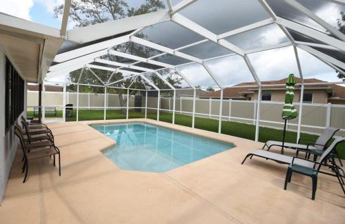 Palm Harbor House | Stunning Fenced Home with Heated Pool & Hot Tub