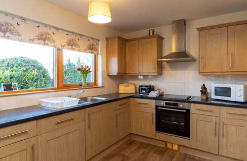 Aviemore Villa | Stunning private villa for 14 guests with WIFI, hot tub, TV, patio and pets allowed